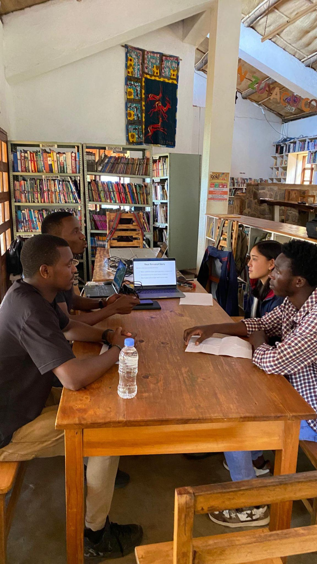 A mentoring session with young learners in a community library during the 2025 program.